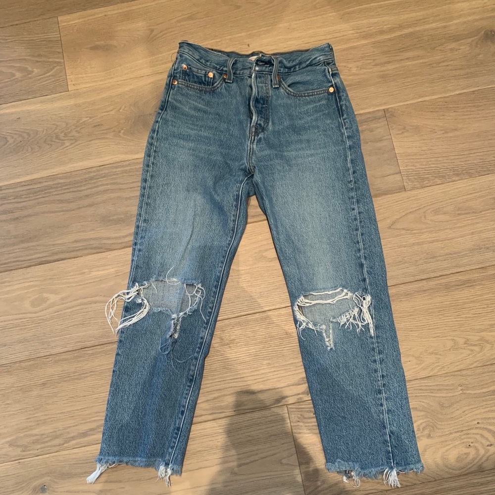 ripped knee high waisted medium wash levi’s